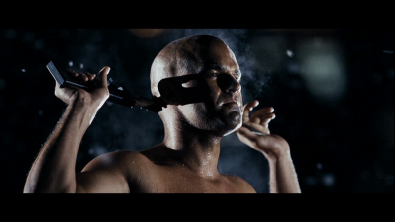 He’s representing the concept of the film.... a steaming pile of something, thats for sure...